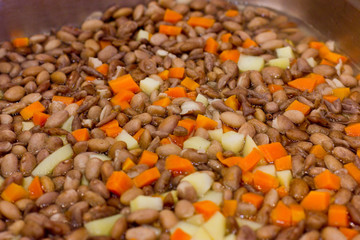 Large stewed beans with potatoes and carrots