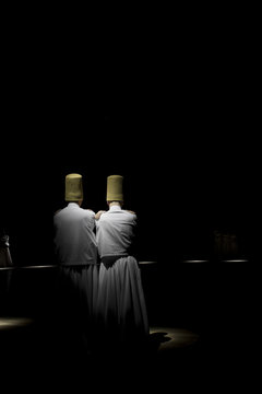 Dervishes perform on the stage for Mevlana	