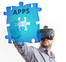 The concept of business, technology, the Internet and the network. A young entrepreneur working on a virtual screen of the future and sees the inscription: APPS