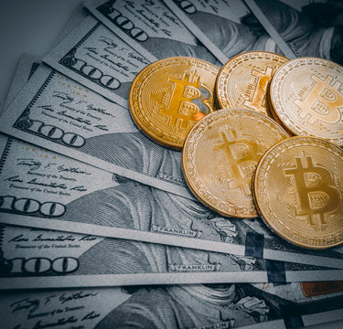 Bitcoin  concept. golden bitcoin coin on us dollars
