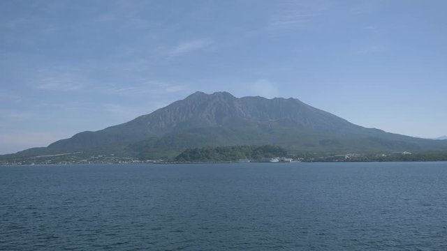 Landscape of Sakurajima volcano in Japan with water around