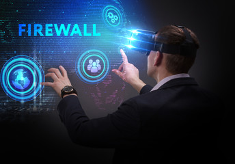 Business, Technology, Internet and network concept. Young businessman working on a virtual screen of the future and sees the inscription: Firewall