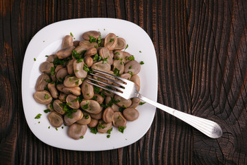 boiled broad beans on a rustic background