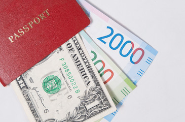 red passport with the dollar and the new Russian banknotes rubles or euros on white background
