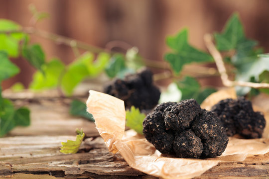 Black truffles on table.