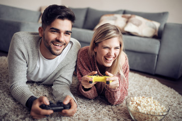 Young couple playing video games © ivanko80