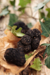 Black truffles on table.