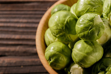 Brussels sprouts on a rustic wooden background