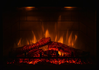 Close up of electric fireplace with orange and yellow fire flame