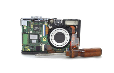 Digital camera disassembled on white background closeup