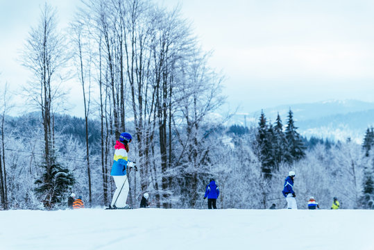 people skiing and snowboarding at winter  mountains