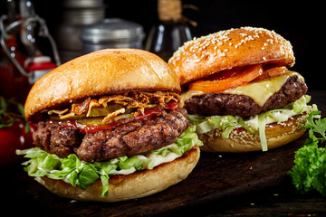 Two delicious beef burgers with salad trimmings