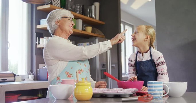 Grandmother and grand daughter having a happy talk 
