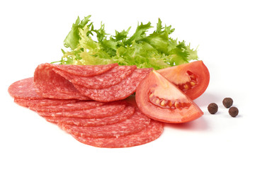Smoked salami with green lettuce, tomatoes and spices, isolated on the white background.