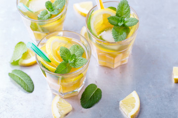 Iced lemon sweet tea with mint in chilled glasses