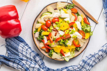 Salad with cheese and fresh vegetables.