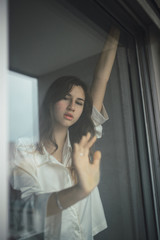 Beautiful woman in the window