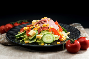 Fresh fruits salad and ham with tomatoes