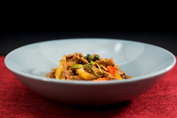 wok fried chicken stir fry with sweet peppers and chinese vegetables