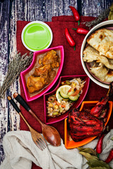 Traditional Indian food chicken tandoori and Tikka with garlic naan