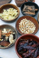 Vintage spices in wooden bowls.