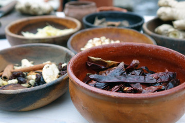 Vintage spices in wooden bowls.