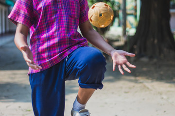 Students take exams Sepak Takraw to use knee to touch the ball in Kanchanaburi Thailand.