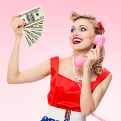 woman with money, talking on phone, dressed in pin-up style dress