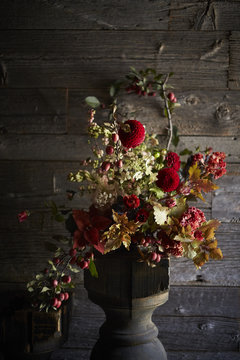 Autumn bouquet of dahlias, crabapples, hydrangea, coxcomb in vase