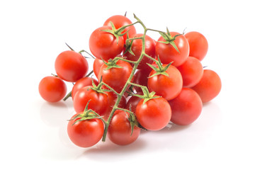 Red tomatoes isolated on white with a clipping path background.