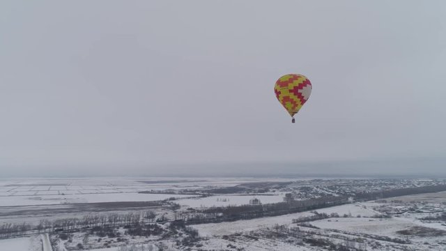 Hot air balloons in the winter season. Aerostat, Airship. Red balloon. 4k