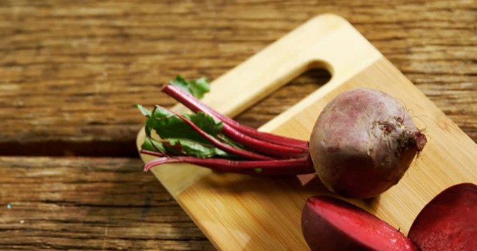 Raw beetroot on chopping board 