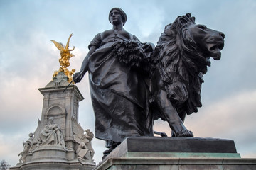 Bronze statues around the Queen Victoria Memorial in front of the Buckingham Palace