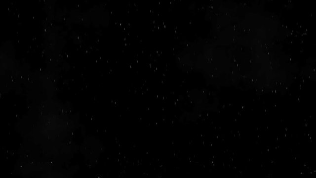 Drops of rain flying down and splashing into the spray on the floor, black background