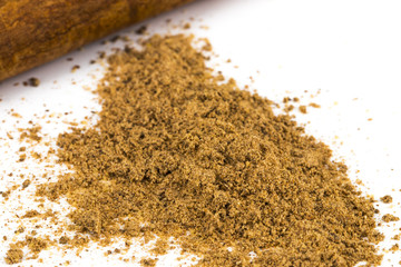 Cinnamon sticks and powder on white background