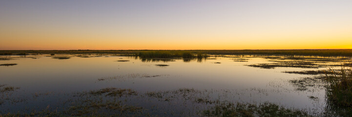 USA, Florida, Beautiful sky panorama of everglades nature landscape after orange sunset