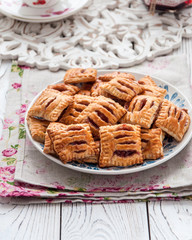 Homemade cookies from puff pastry with strawberry jam