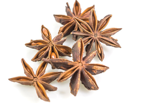 Star anise spice fruits and seeds isolated on white background, with clipping path close up
