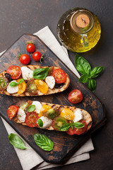 Bruschetta with tomatoes, mozzarella and basil