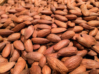 Pile of nut almonds close-up