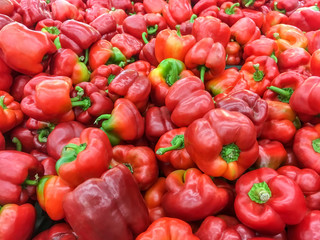 Pile of ripe red bell pepper close-up
