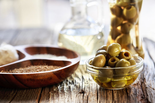 fresh olives on a wooden table