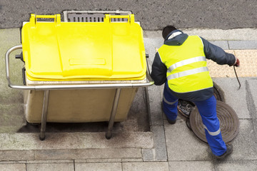 sewer line drainage  by utilities workers