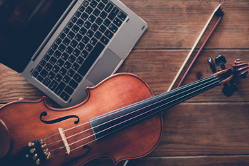 Fototapeta na wymiar online violin play teaching courses. classical musical instrument art. modern internet technology advantages concept