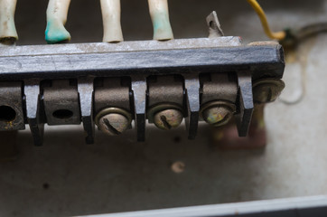 A number of modular contactors, cable channel and wire. Wire laid in the cable channel and connected to the modular contactors in electrical Cabinet. The wires from the terminals and marking.