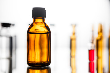 Group of ampoules with a transparent medicine in medical laboratory