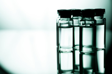 Group of ampoules with a transparent medicine in medical laboratory