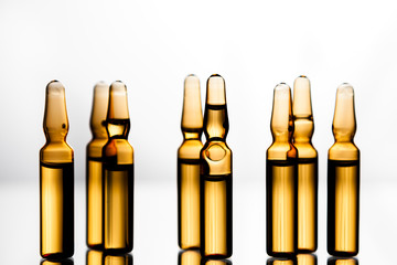 Group of ampoules with a transparent medicine in medical laboratory