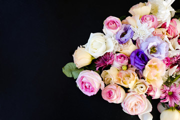 beautiful flowers assortment on dark background. free space concept. floristic art