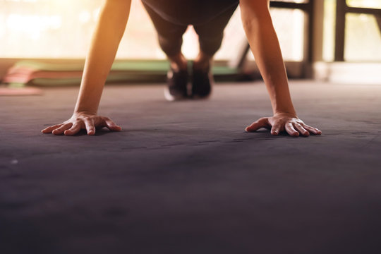 Closeup Woman Hand Doing Push Ups Exercise In A Gym.